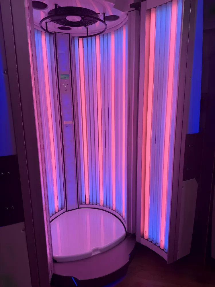 Hybrid stand-up sunbed cabin glowing pink